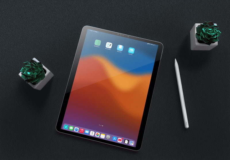 An iPad with an Apple Pencil showing Mindspace, Goodnotes, Day One, and Journey app icons on the home screen